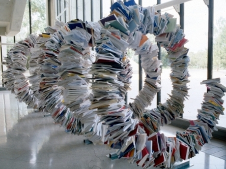 A photo of sculpture called Carved information as object.  Created by artist  Graham Hay, from 4 tonnes of Government documents, measuring 2.5 x 2.5 x 6 metres. Photography by M. Lockhart.